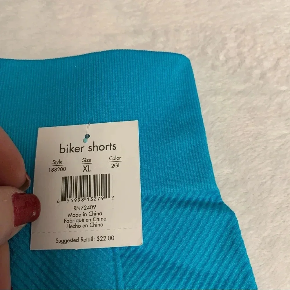 LA LA active biker shorts teal color size XL NWT has texture to them